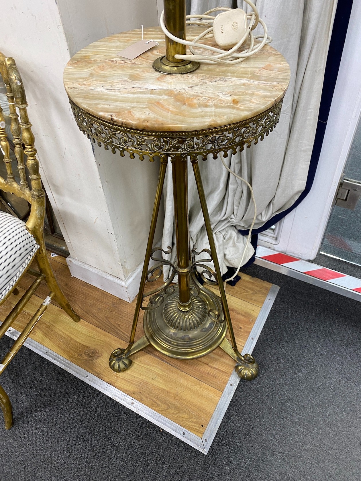 An Edwardian brass and green onyx telescopic standard lamp (converted to electricity).